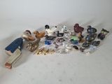 a lot of figurines that are sitting on a table