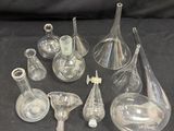 a lot of glass vases that are on a table