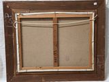 an old picture frame with a picture hanging on a rope