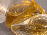 a close up of a glass object with a liquid inside of it