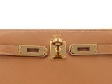 a brown leather purse with gold hardware on the front