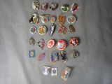 a lot of different pins and badges on a table