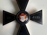 an image of a medal with a cross on it on a white surface