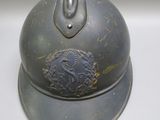 a helmet with a hand on it sitting on a table