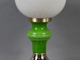 an image of a green and white table lamp with a white glass shade