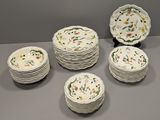 many plates that are sitting on a table