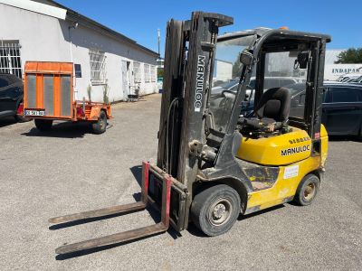 a yellow forklift truck parked in a parking lot