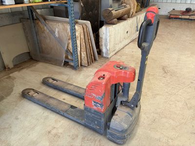 a picture of a fork lifter in a garage