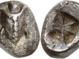an image of a pair of silver coins on a white surface