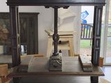 a wooden table with a clock on it in a room