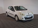 a picture of a small white car parked in a garage