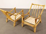 pair of bamboo chairs in the style of a bamboo chair with a cushion