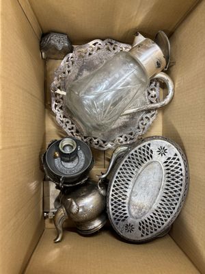 a box with a lot of silver items inside of it