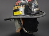 a close up of a fireman ' s helmet on a mannequin head