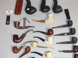 many different types of smoking pipes on the table