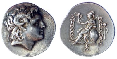 a close up of a silver coin with a woman on it
