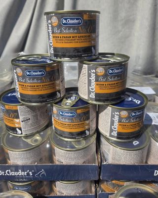many cans of food that are stacked on top of each other
