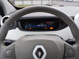 steering wheel of a car with a digital display on the dashboard