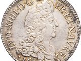 a silver coin with the head of a woman on it
