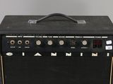 a close up of a guitar amplifier sitting on top of a table