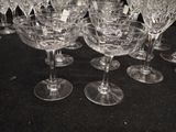 a lot of empty wine glasses sitting on a table