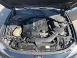 the engine of a bmw car with its hood open