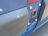 a close up of a blue truck with a sign on it