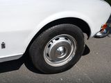 a white car parked on the side of the road