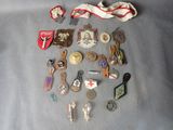 a lot of badges and pins on a table