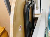 a close up of an old sewing machine with a book on the table