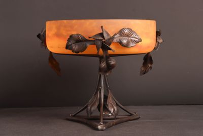 an image of a table lamp with leaves on it