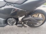 a close up of a motorcycle parked in a parking lot