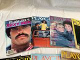 several magazine covers of a man with a mustache and moustache sitting on a bed