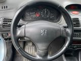 dashboard view of a car with a steering wheel and dashboard controls