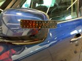 a close up of a car door handle with a sticker on it