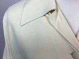 a white shirt with a tie on a mannequin neck