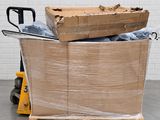 a pallet full of boxes sitting on the floor next to a hand truck