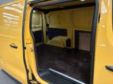 a yellow van with the door open and the seat down