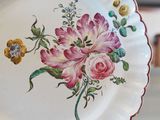 a white plate with a floral design on it