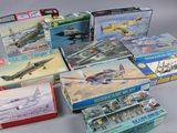 a lot of model airplanes and boxes on the table