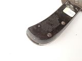 a knife that is laying on a table