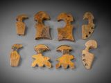 several pieces of wood are arranged together on a gray surface