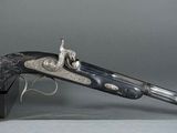 a gun that is sitting on top of a box