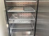 a refrigerator that has a lot of shelves inside of it