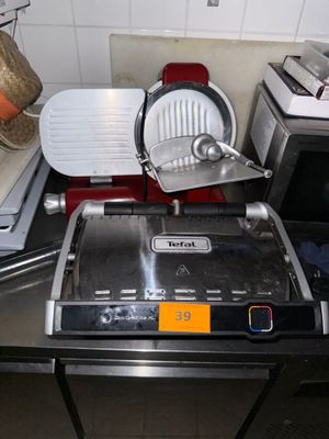 an image of a kitchen with a pizza cutter on the counter