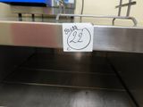 a sticker that is attached to the side of a conveyor belt