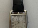 a watch that is on display on a table