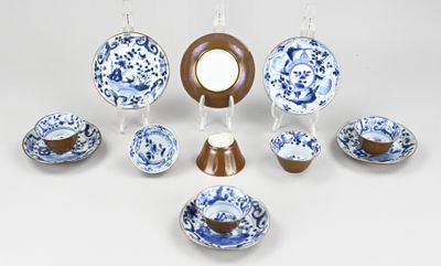 a group of blue and white plates and bowls