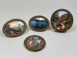 four miniature picture frames with a picture of a lake and a boat