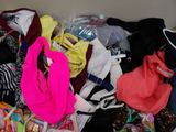 a box full of clothes that is sitting on the floor